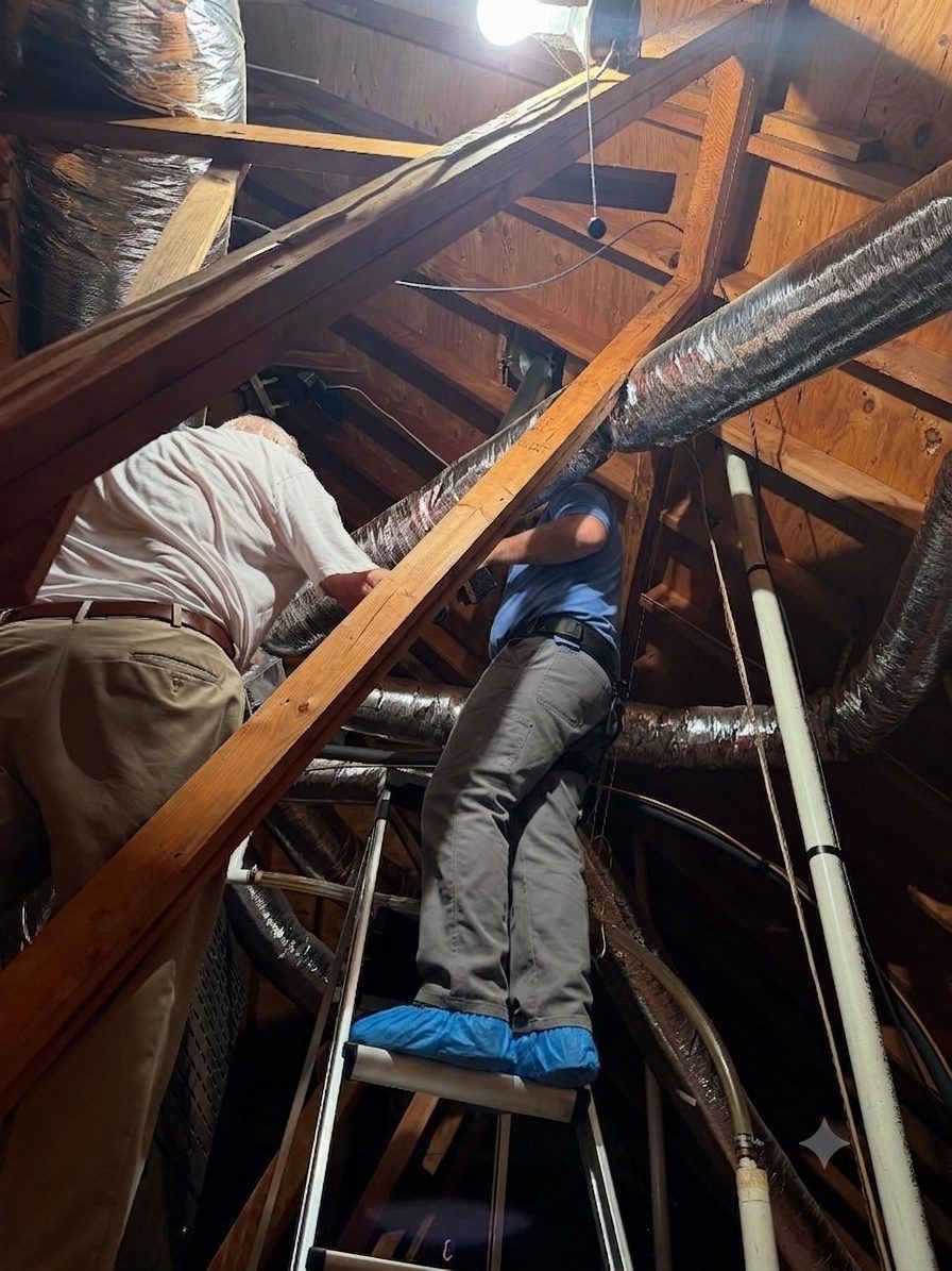 Yes We Clean crew installing Larry's new furnace chimney and vent lines